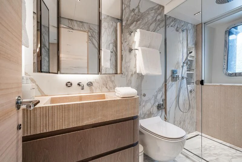 a bathroom with a glass shower aboard PARA BELLVM Yacht for Charter