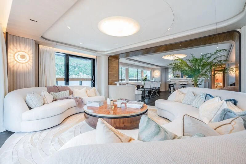 a living room with a large window aboard PARA BELLVM Yacht for Charter