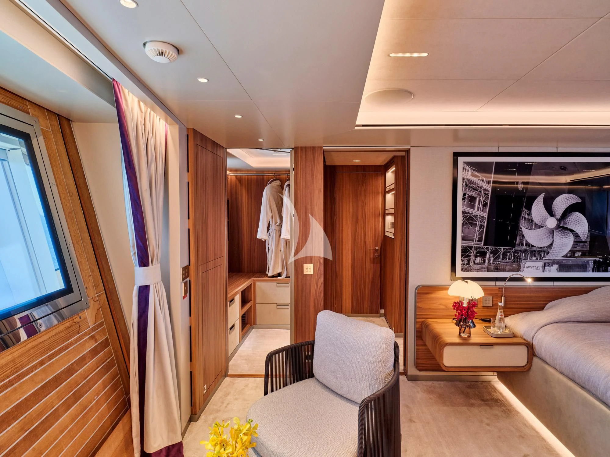 a room with a couch and a table and a chair aboard PARA BELLVM Yacht for Charter
