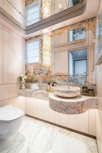 a bathroom with a large mirror aboard PARA BELLVM Yacht for Charter