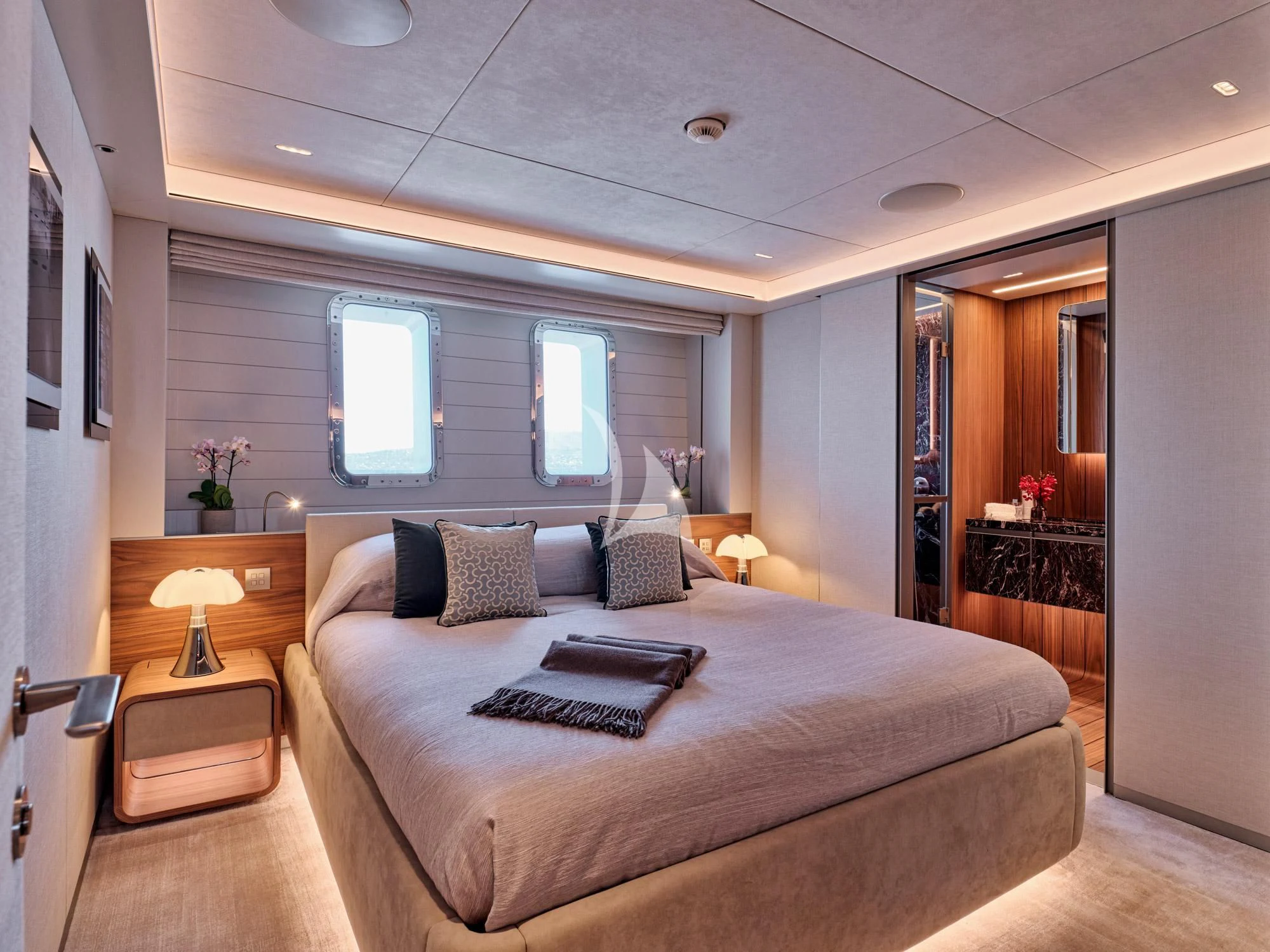 a bedroom with a bed and a desk aboard PARA BELLVM Yacht for Charter
