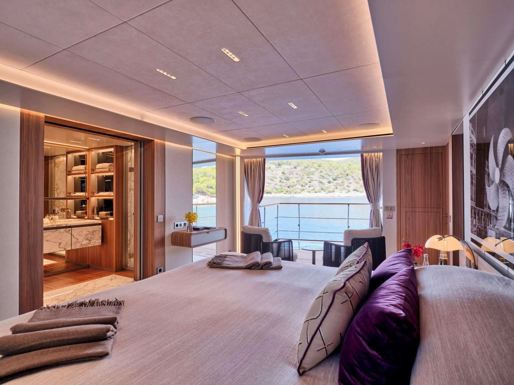 a large bedroom with a large bed aboard PARA BELLVM Yacht for Charter