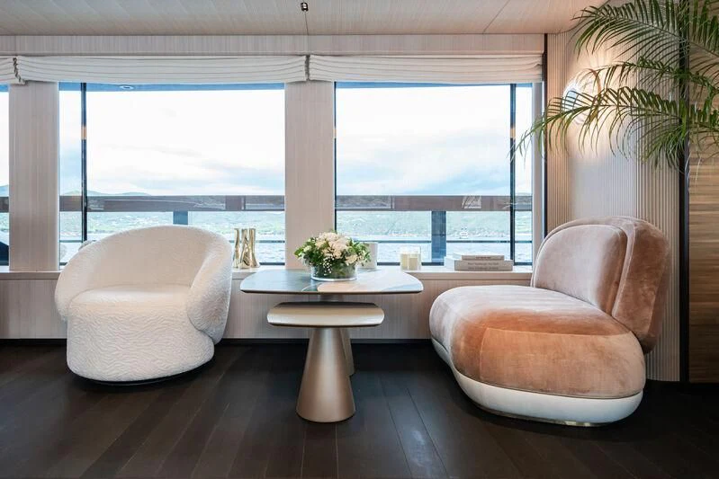 a room with a table and chairs aboard PARA BELLVM Yacht for Charter