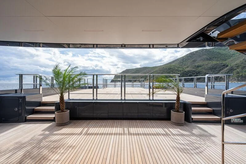 a balcony overlooking a body of water aboard PARA BELLVM Yacht for Charter