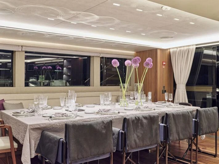 a table set for a dinner aboard PARA BELLVM Yacht for Charter