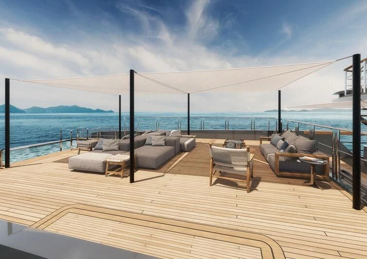 a deck with chairs and a body of water in the background aboard PARA BELLVM Yacht for Charter