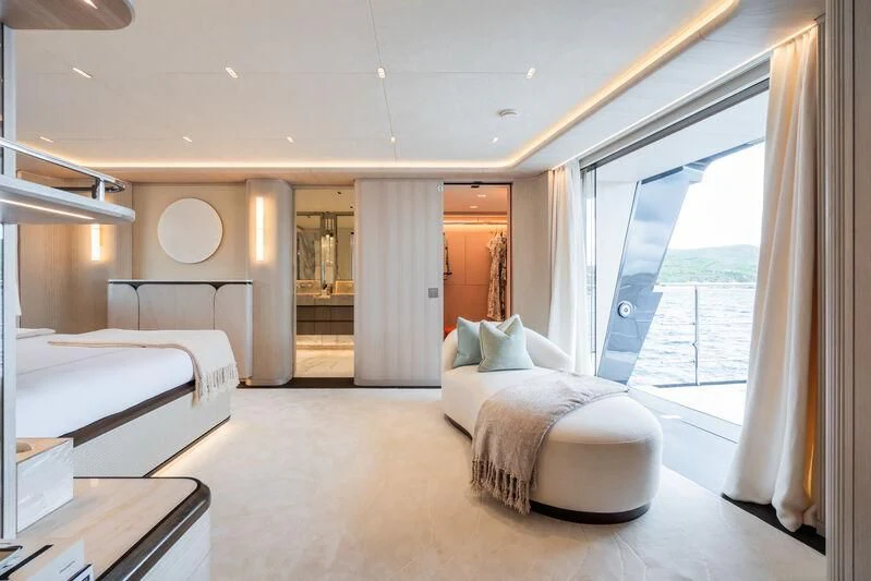 a room with a bed and a window aboard PARA BELLVM Yacht for Charter