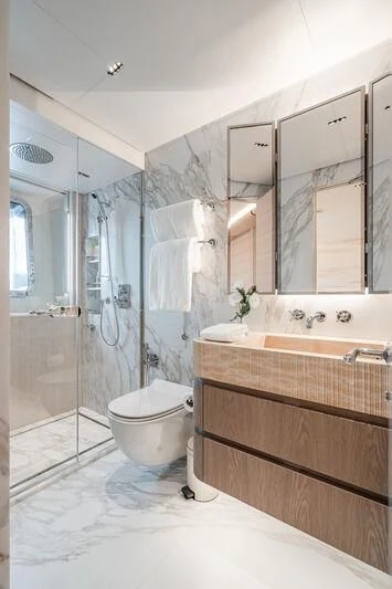 a bathroom with a glass shower aboard PARA BELLVM Yacht for Charter