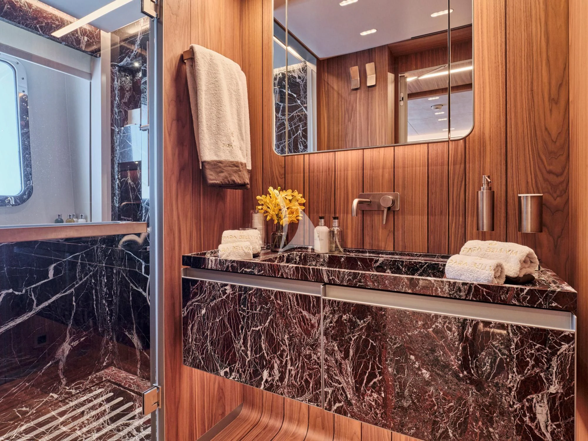 a bathroom with a large mirror aboard PARA BELLVM Yacht for Charter