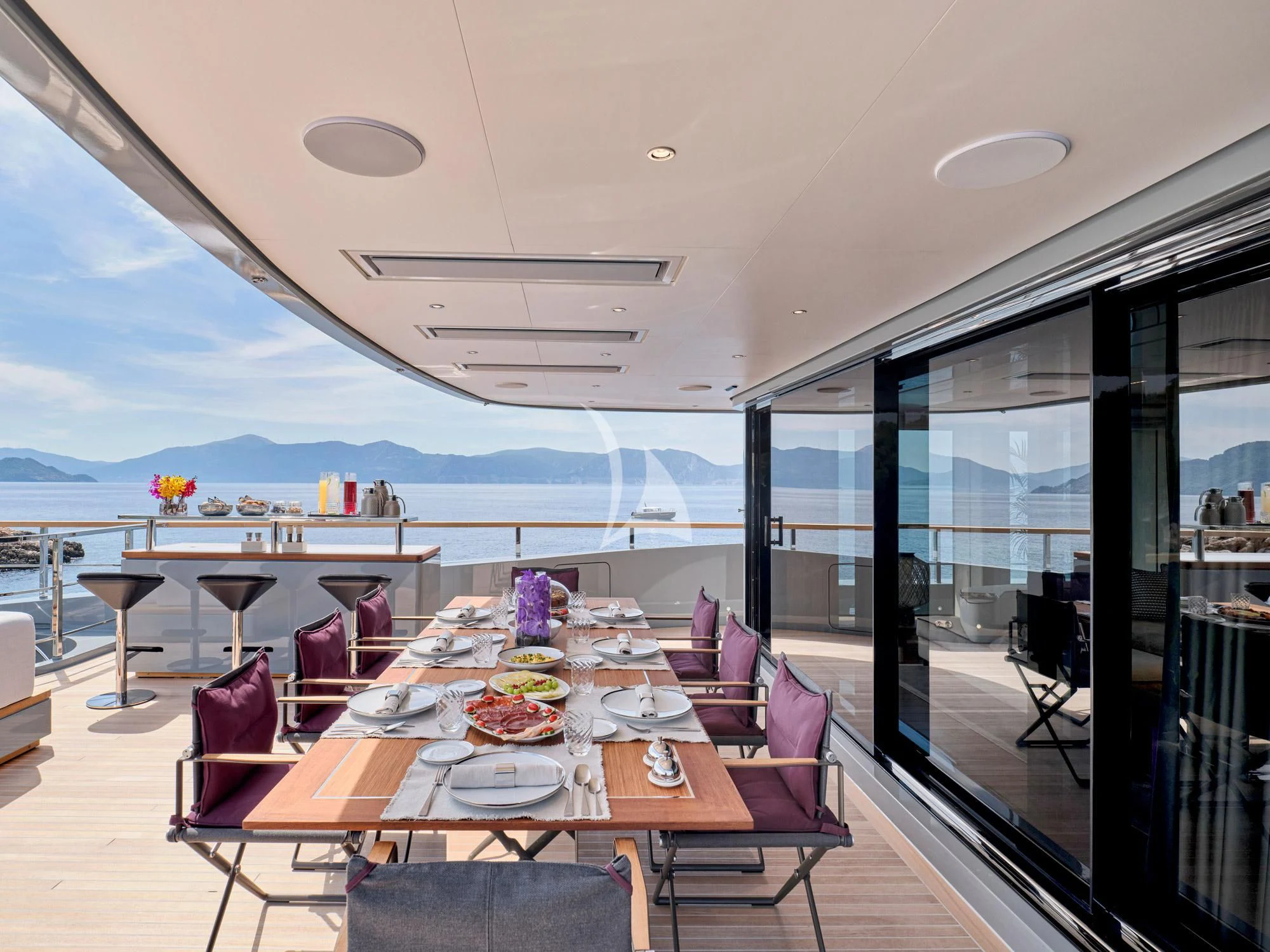 a large dining table in a room aboard PARA BELLVM Yacht for Charter