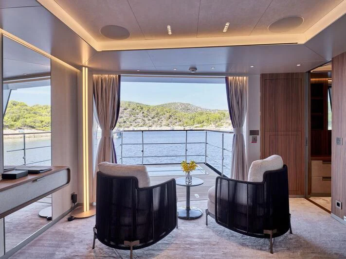 a black chair in a room aboard PARA BELLVM Yacht for Charter