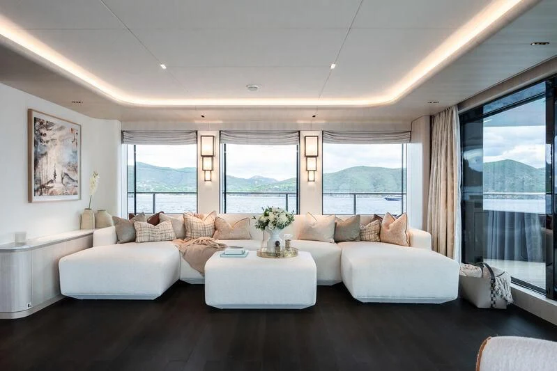 a living room with a large window aboard PARA BELLVM Yacht for Charter