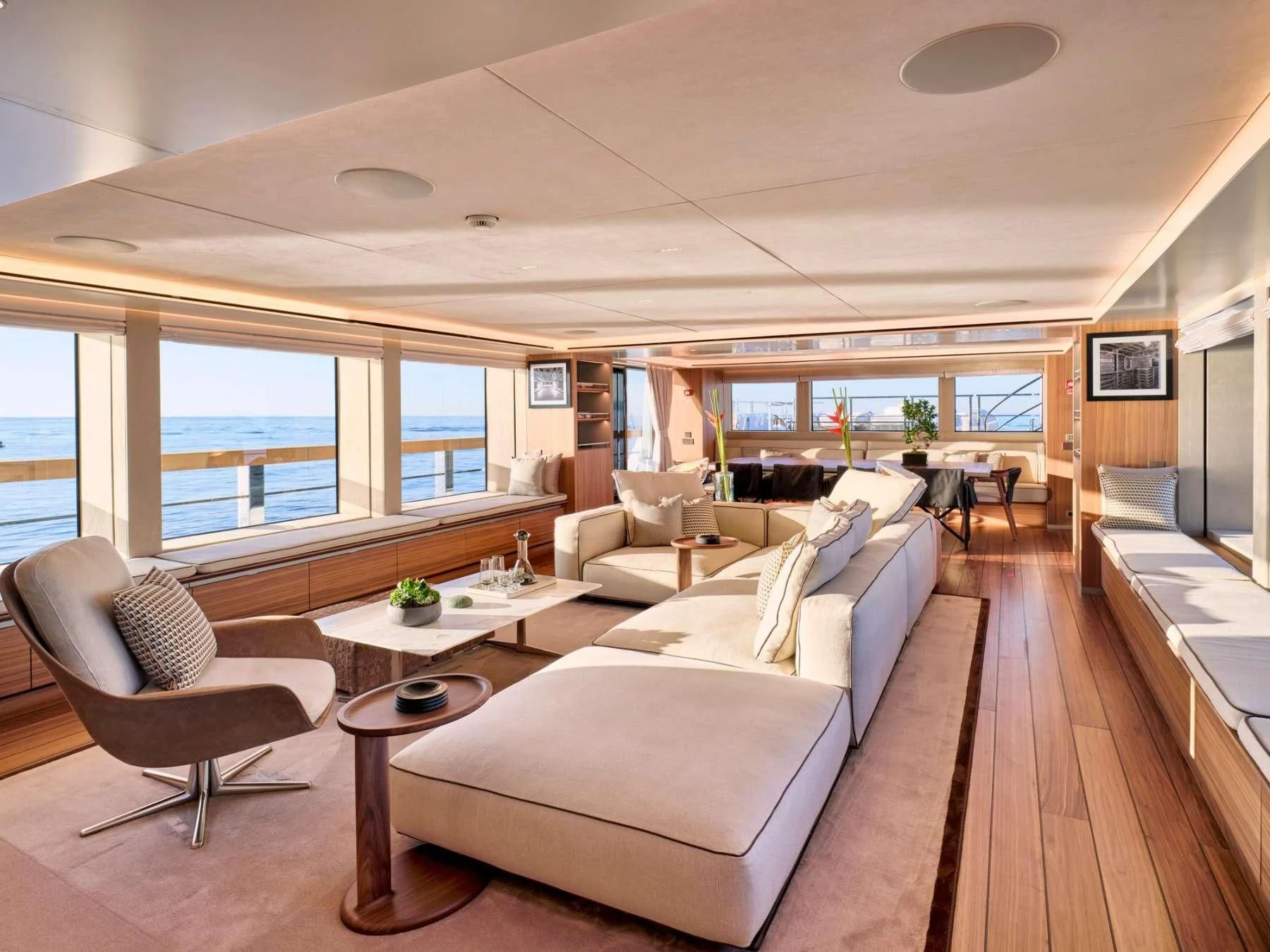 a living room with a large window aboard PARA BELLVM Yacht for Charter