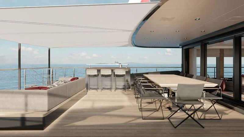 a room with a table chairs and a view of the ocean aboard PARA BELLVM Yacht for Charter