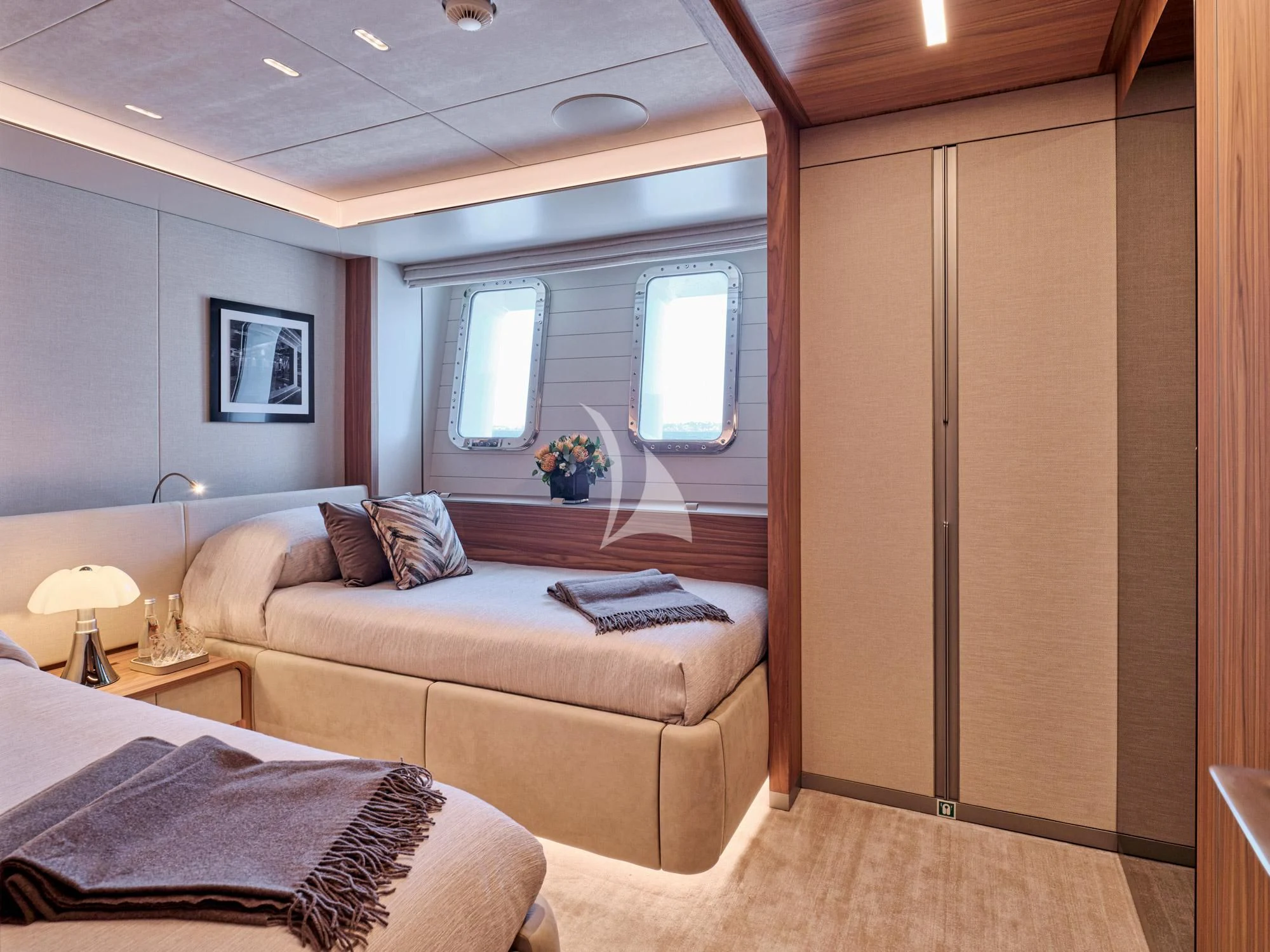 a bedroom with a bed and a desk aboard PARA BELLVM Yacht for Charter