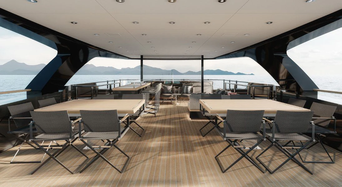 a room with tables and chairs aboard PARA BELLVM Yacht for Charter