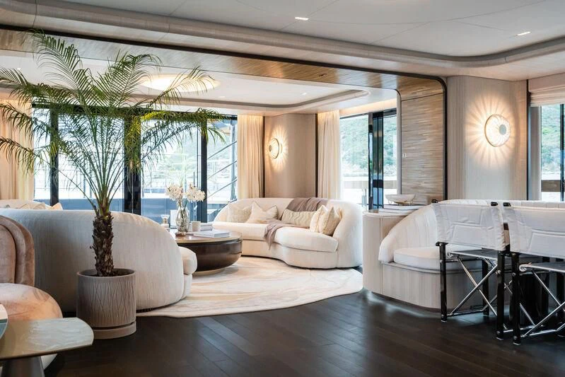 a living room with a large window aboard PARA BELLVM Yacht for Charter