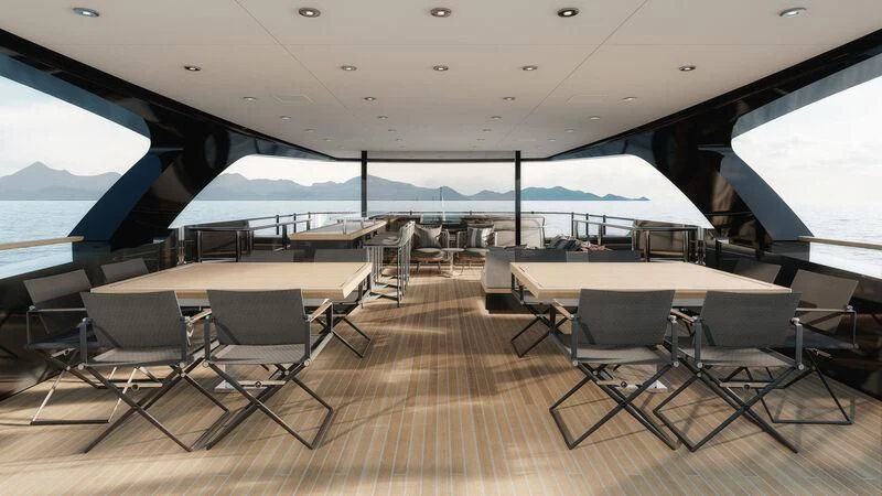 a room with tables and chairs aboard PARA BELLVM Yacht for Charter