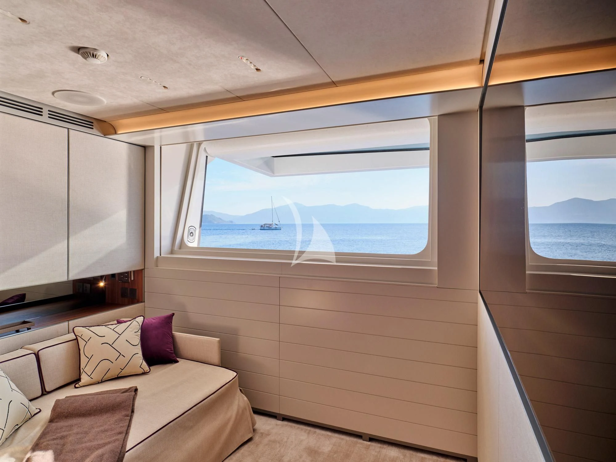 a room with a bed and a window aboard PARA BELLVM Yacht for Charter