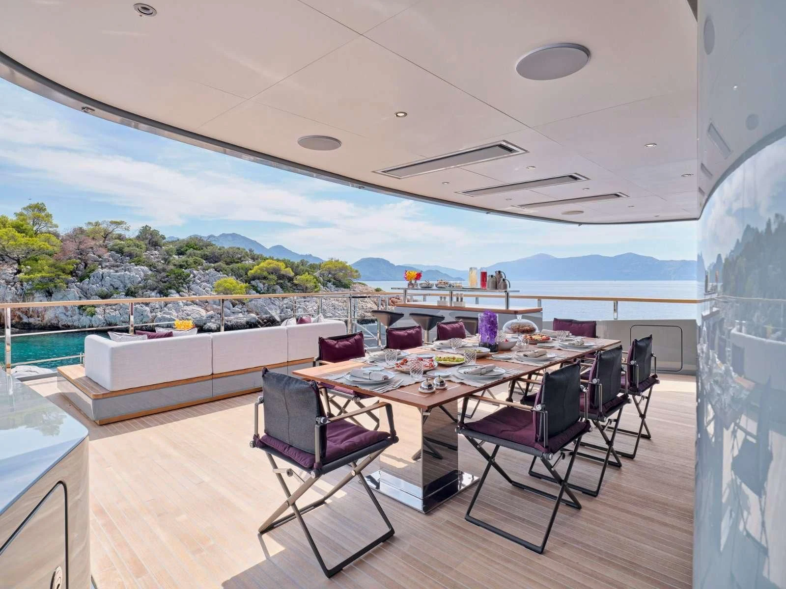a room with a table and chairs aboard PARA BELLVM Yacht for Charter