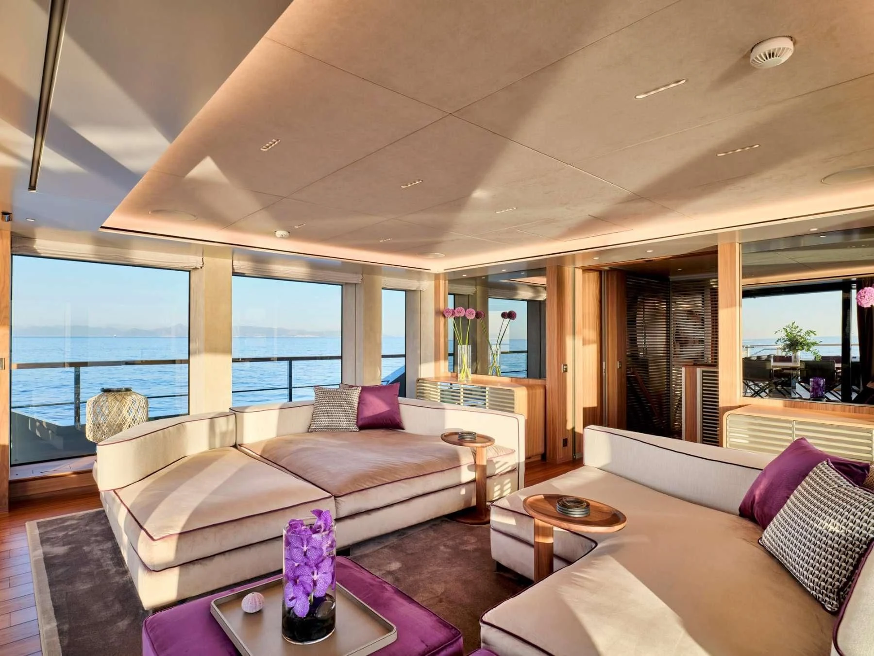a living room with a large window aboard PARA BELLVM Yacht for Charter