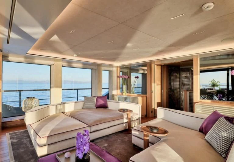 a living room with a large window aboard PARA BELLVM Yacht for Charter