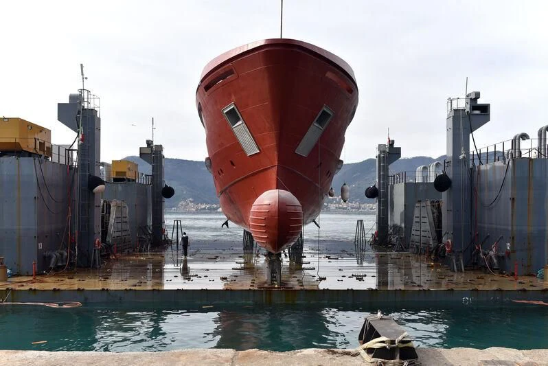 a large red and white ship aboard PARA BELLVM Yacht for Charter