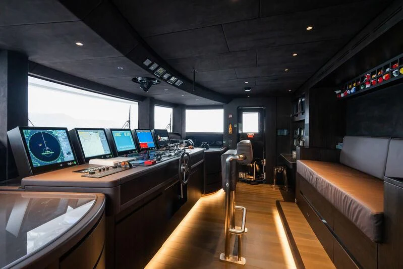 a room with computers and monitors aboard PARA BELLVM Yacht for Charter