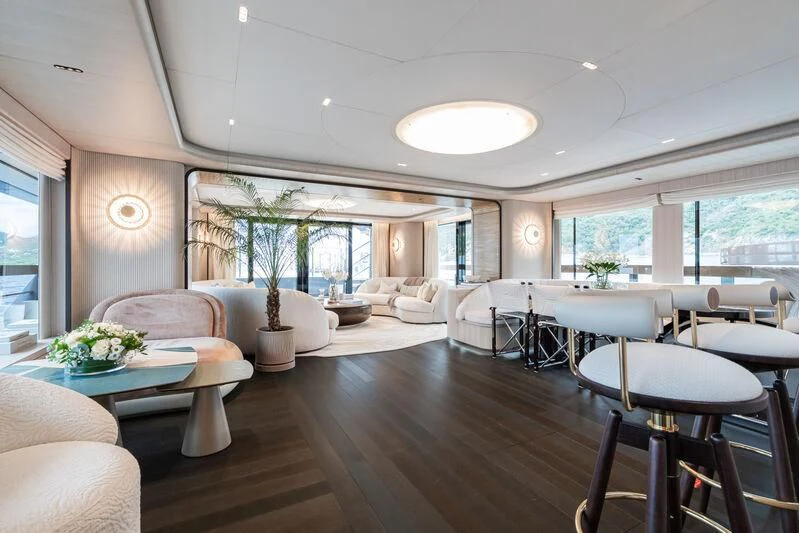 a room with tables and chairs aboard PARA BELLVM Yacht for Charter
