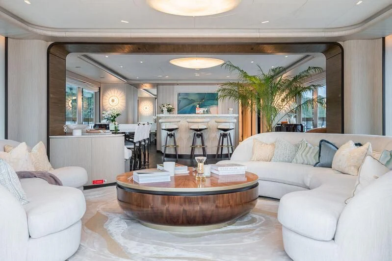 a living room with a table and chairs aboard PARA BELLVM Yacht for Charter