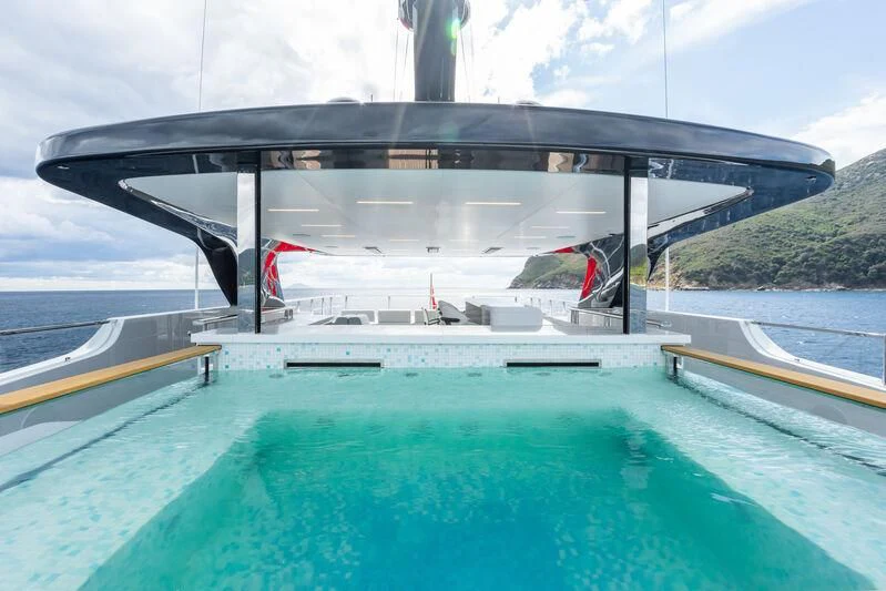 a large black building with a flag on it aboard PARA BELLVM Yacht for Charter