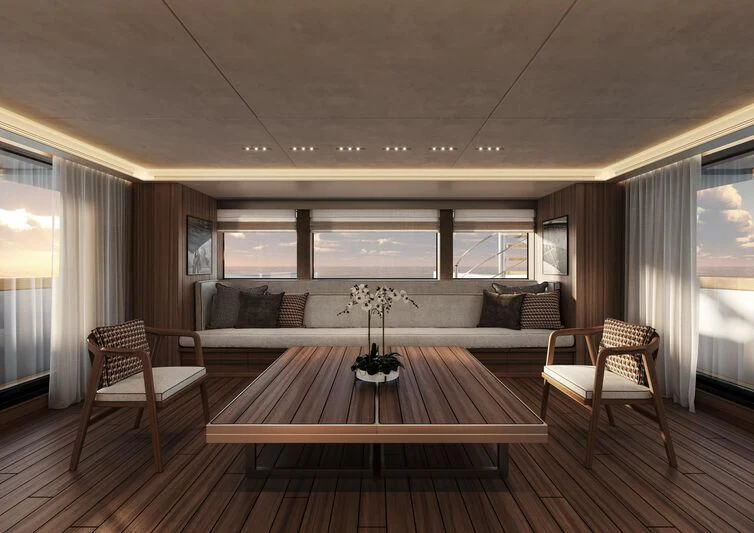 a room with a wood table and chairs and a couch aboard PARA BELLVM Yacht for Charter