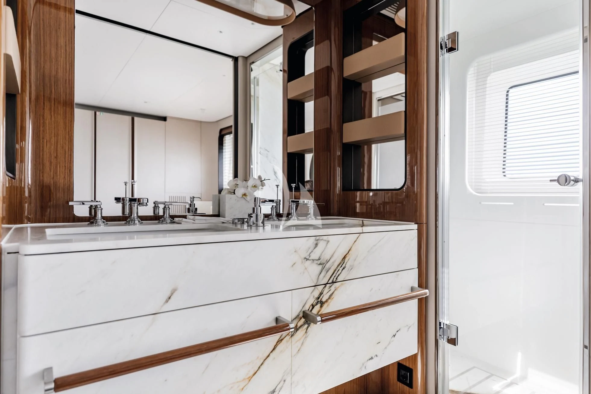 a bathroom with a sink and a mirror aboard LUZ DE MAR Yacht for Sale