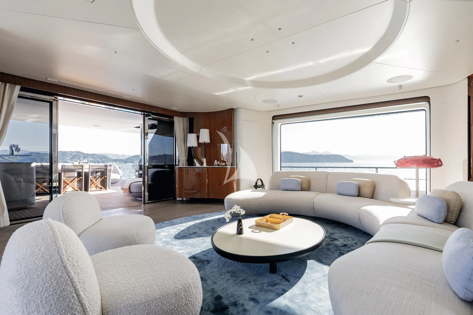 a living room with a large window aboard LUZ DE MAR Yacht for Sale