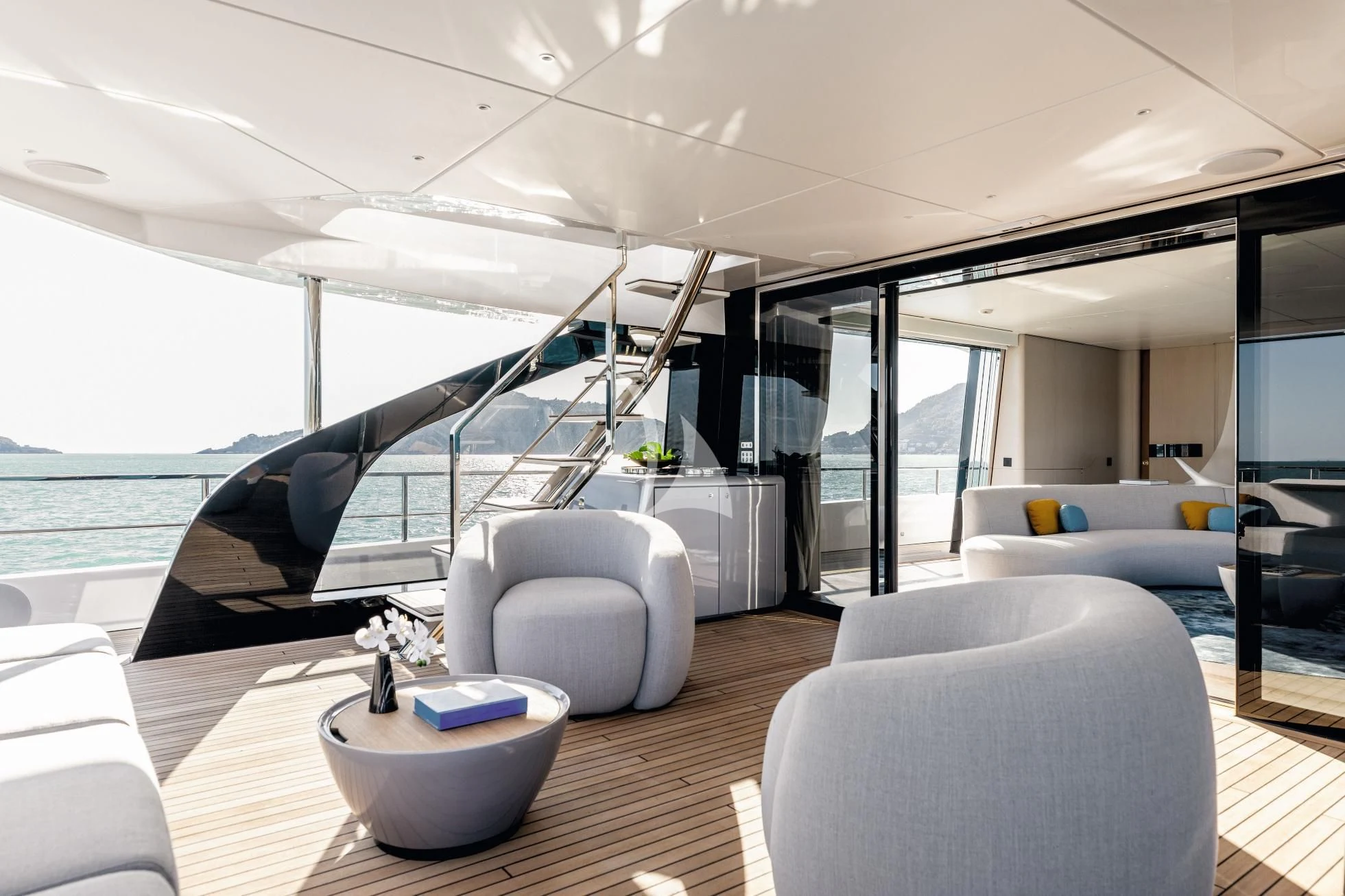 a modern living room with a large open window aboard LUZ DE MAR Yacht for Sale