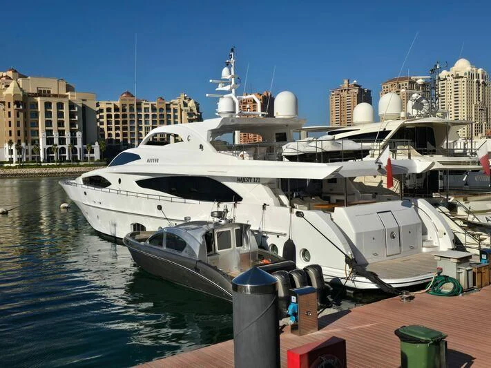 a large white boat docked aboard METEOR Yacht for Sale
