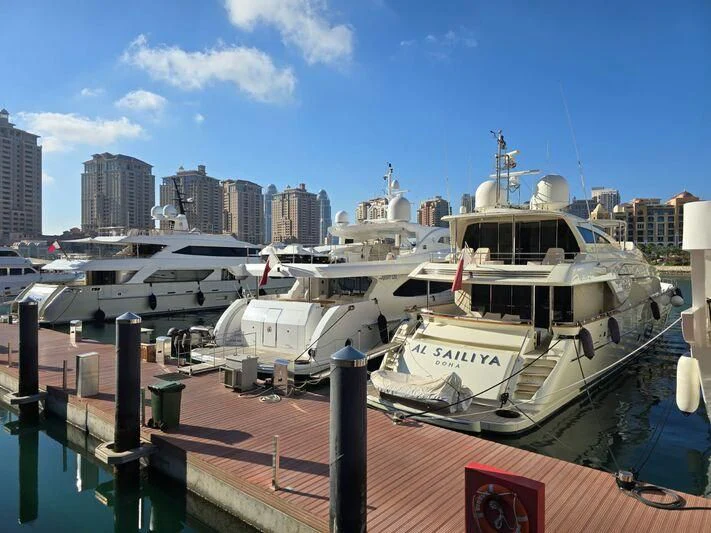 boats docked at a pier aboard METEOR Yacht for Sale