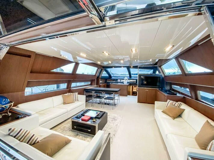 a room with a couch and a table aboard EVENFLOW Yacht for Sale