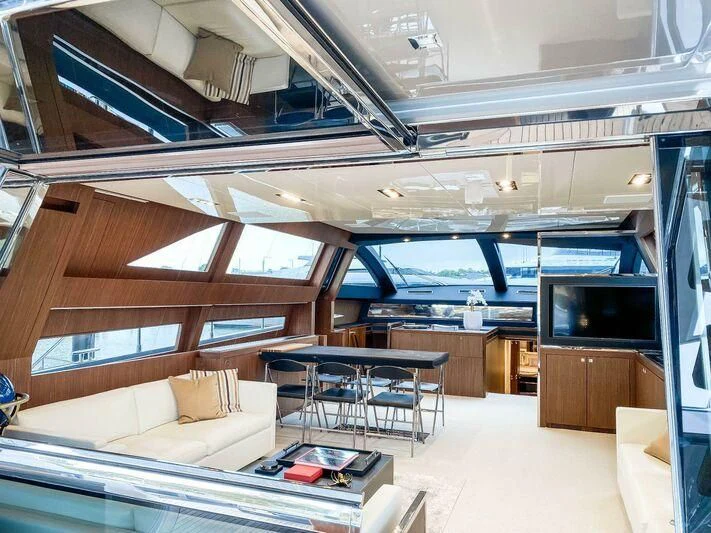 a room with a couch and a tv aboard EVENFLOW Yacht for Sale