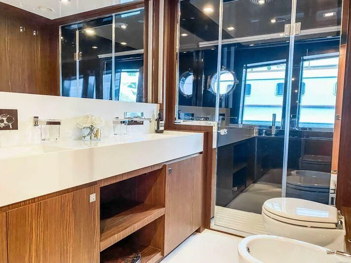 a bathroom with a large mirror aboard EVENFLOW Yacht for Sale