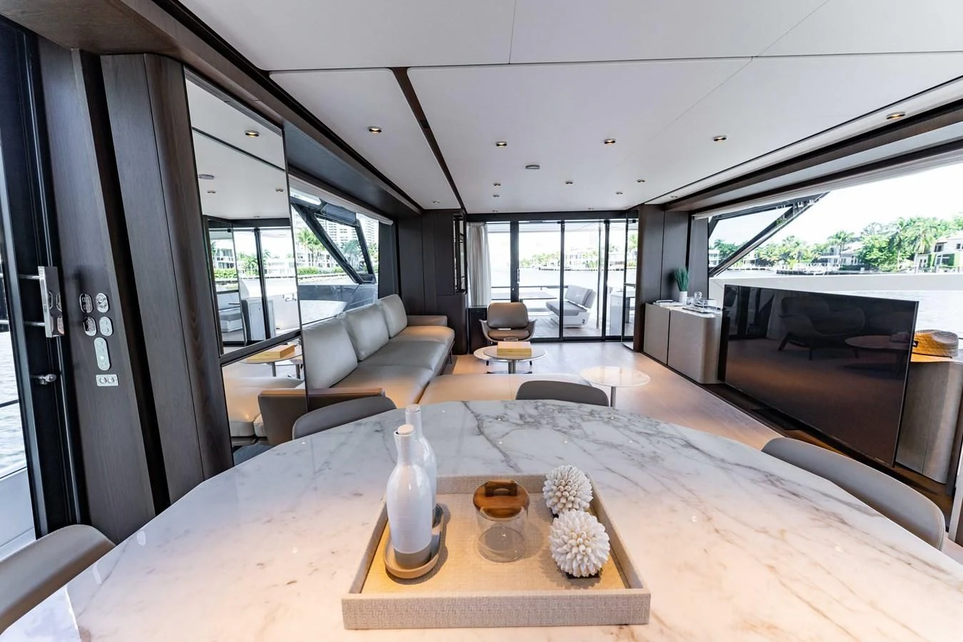 a living room with a table and chairs aboard VITTORIA Yacht for Sale