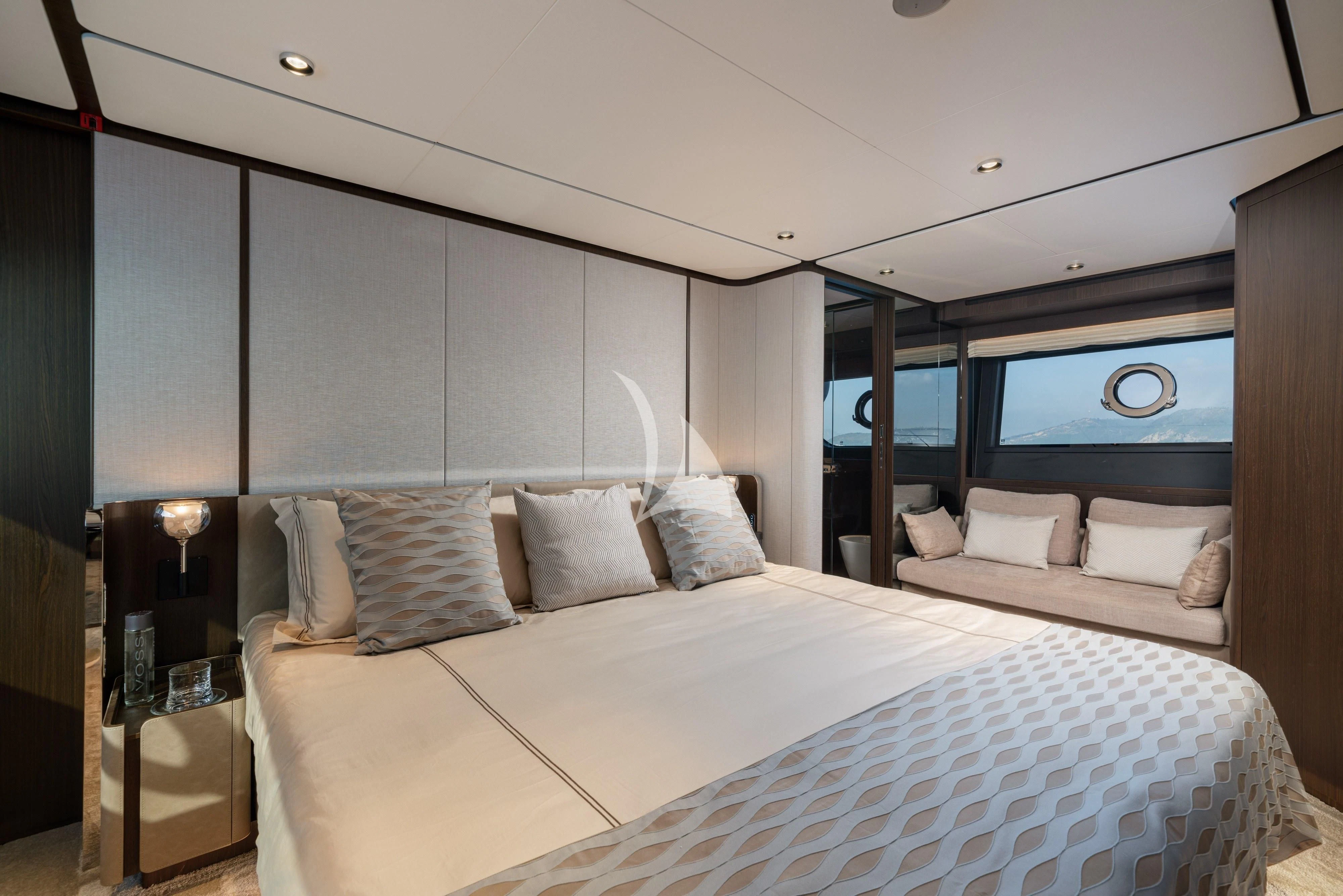 a bed with pillows and a mirror aboard VITTORIA Yacht for Sale