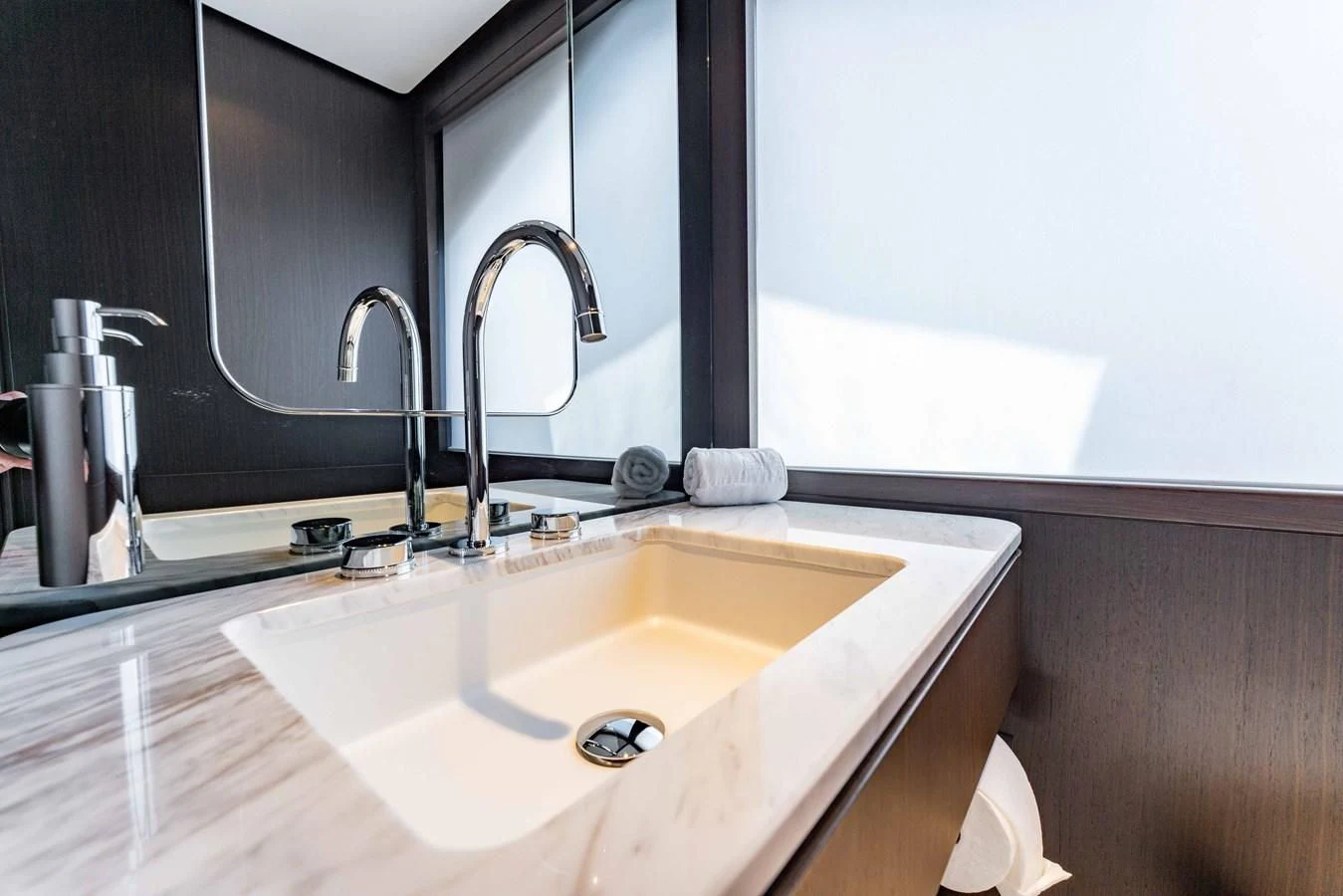a bathroom with a sink and a mirror aboard VITTORIA Yacht for Sale
