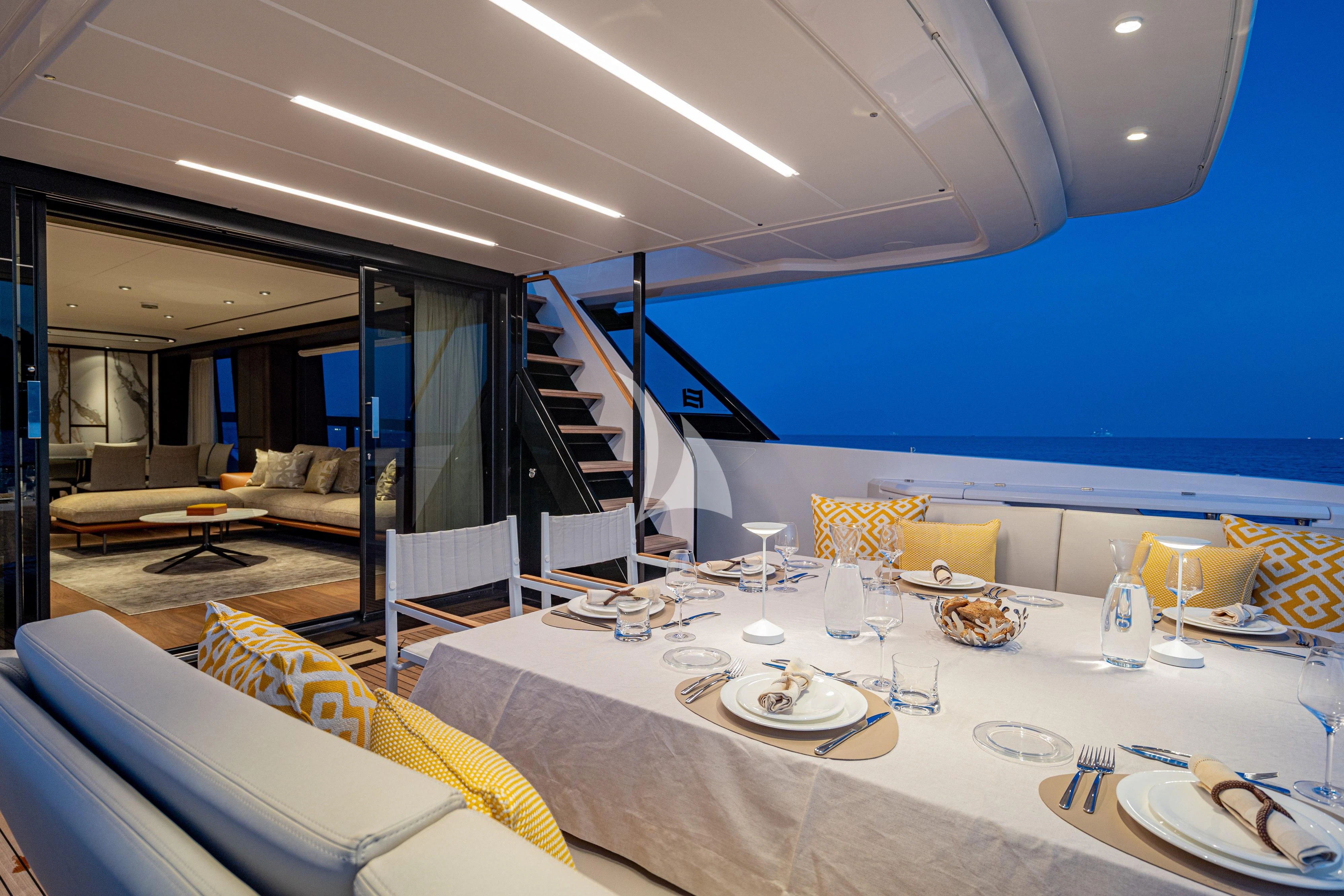 a dining room with a large white table and chairs aboard VITTORIA Yacht for Sale