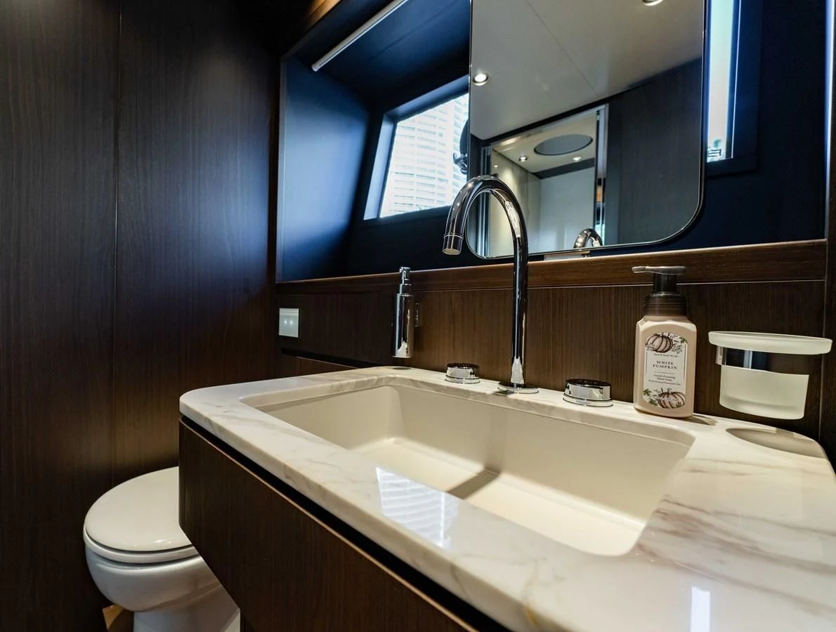 a bathroom with a sink and a toilet aboard VITTORIA Yacht for Sale