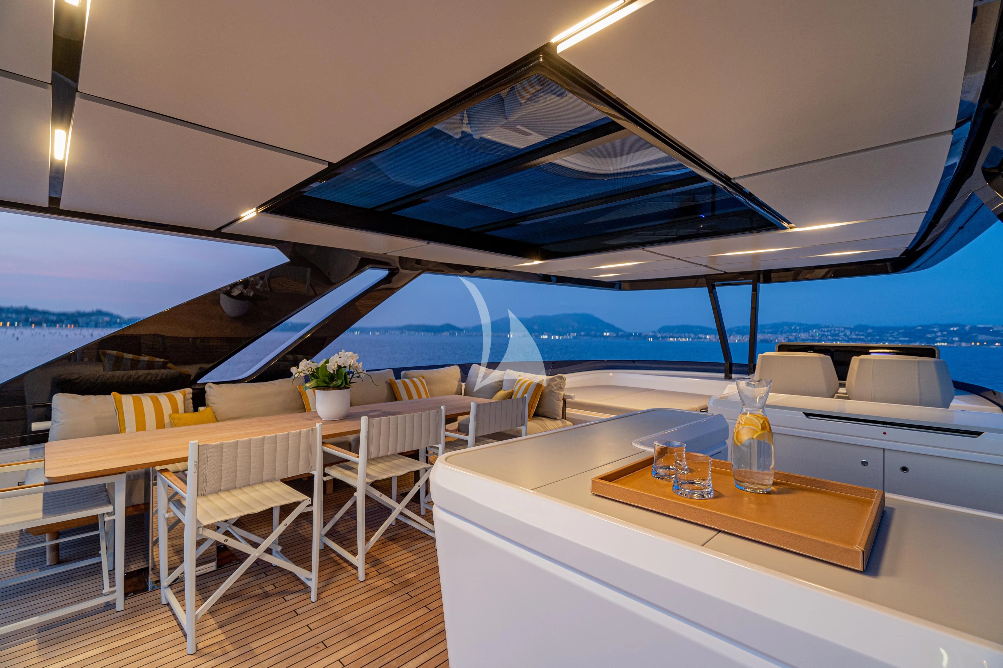 a room with tables and chairs aboard VITTORIA Yacht for Sale