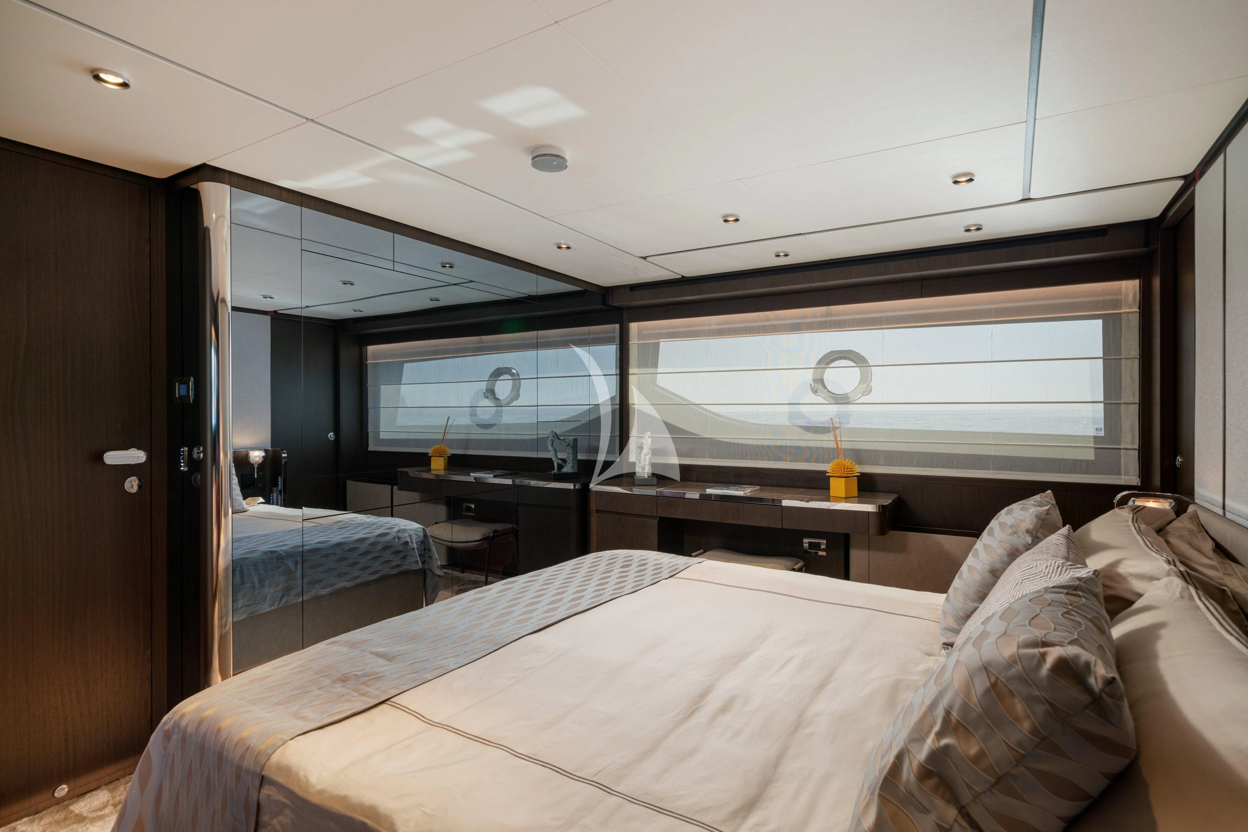 a room with a bed and a desk aboard VITTORIA Yacht for Sale