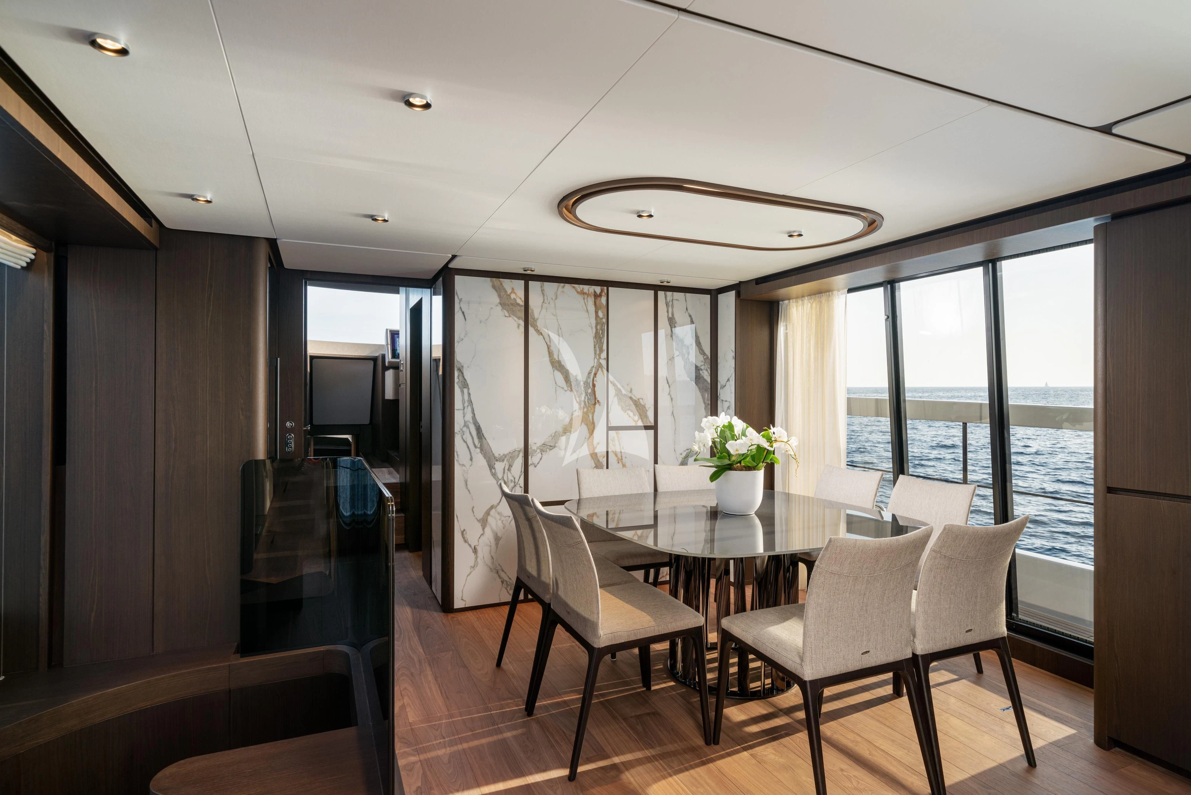 a dining room with a table and chairs aboard VITTORIA Yacht for Sale