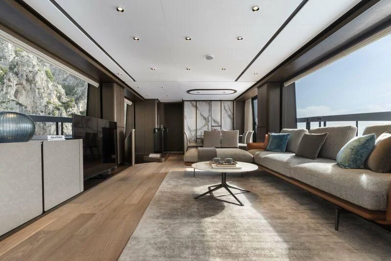 a living room with a large window aboard VITTORIA Yacht for Sale