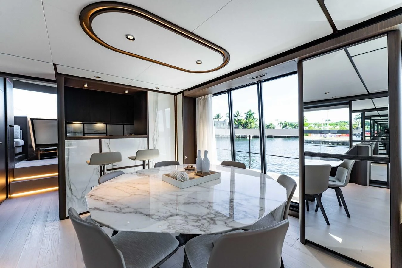 a large room with a large table and chairs aboard VITTORIA Yacht for Sale